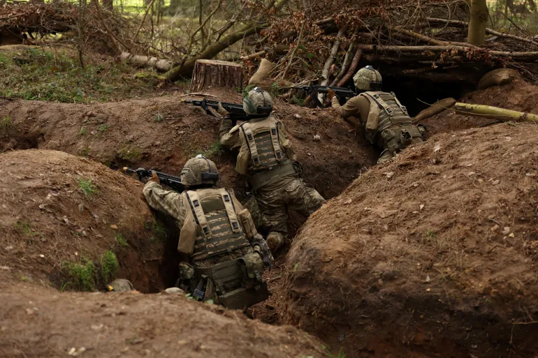 Ukrainian soldiers take part in a final tactical exercise on the fourth anniversary of Russia's full-scale invasion of Ukraine, held at a British Army training camp in East Anglia, Britain, February 24, 2026. REUTERS/Chris Radburn