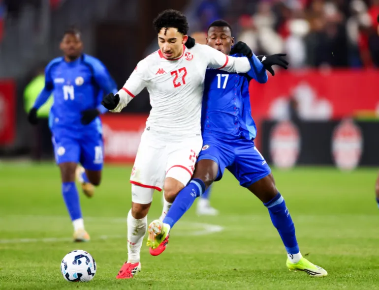 Soccer Football - International Friendly - Haiti v Tunisia - Toronto Stadium, Toronto, Canada - March 28, 2026 Haiti's Danley Jean Jacques in action with Tunisia's Rayan Elloumi REUTERS/Cole Burston
