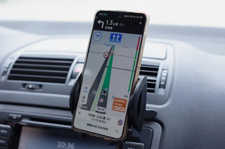 Beijing, China - October 6, 2024: A driver uses the Auder Map APP to navigate to his destination. Beidou Navigation Satellite System (BDS) is a global satellite navigation system developed by China.