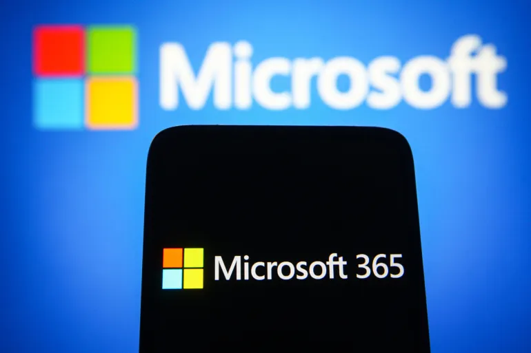 UKRAINE - 2021/09/16: In this photo illustration a Microsoft 365 logo is seen on a smartphone screen with a Microsoft logo in the background. (Photo Illustration by Pavlo Gonchar/SOPA Images/LightRocket via Getty Images)