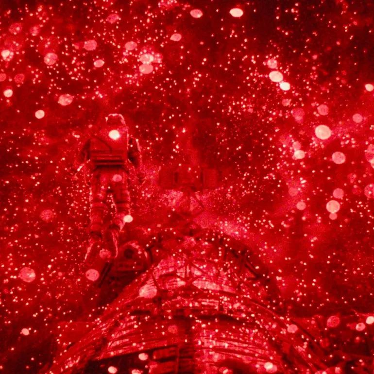 He is shown outside his spaceship, the Hail Mary, surrounded by swirling points of red light representing the organism known as Astrophage. Project Hail Mary (2026) movie #ProjectHailMary ...