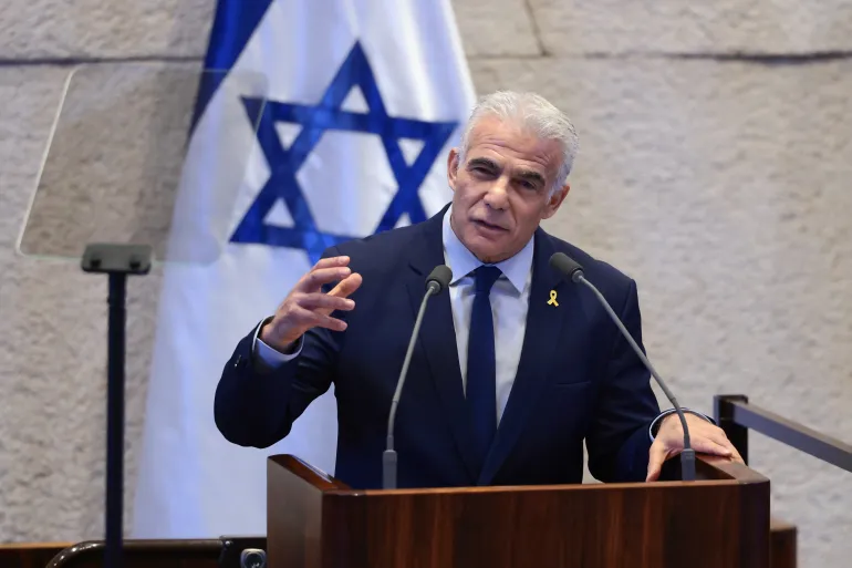 JERUSALEM - OCTOBER 13: Israeli opposition leader Yair Lapid speaks at the Knesset, Israel's parliament, on October 13, 2025 in Jerusalem. President Trump is visiting the country hours after Hamas released the remaining Israeli hostages captured on Oct. 7, 2023, part of a US-brokered ceasefire deal to end the war in Gaza. (Photo by Evelyn Hockstein - Pool/Getty Images)