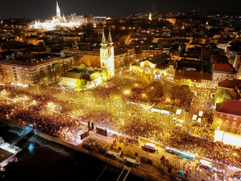 A drone view shows people gathering to celebrate across the River Danube from the Parliament building, following the partial results of the parliamentary election, in Budapest, Hungary, April 12, 2026. REUTERS/Stringer TPX IMAGES OF THE DAY
