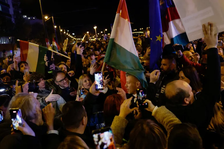 Peter Magyar, leader of the opposition Tisza party, and supporters celebrate, after Hungarian Prime Minister Viktor Orban conceded defeat in the parliamentary election, in Budapest, Hungary, April 12, 2026. REUTERS/Leonhard Foeger