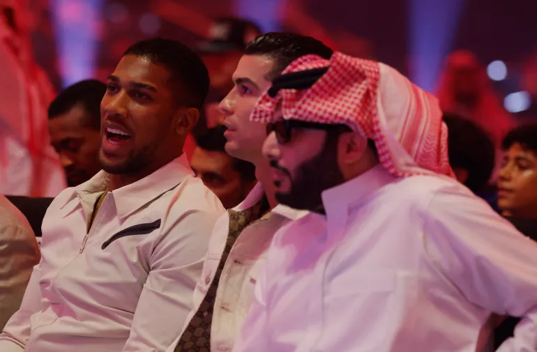 Boxing - Tyson Fury v Oleksandr Usyk - Kingdom Arena, Riyadh, Saudi Arabia - May 18, 2024 Anthony Joshua, Cristiano Ronaldo and Turki bin Abdul Mohsen Al-Sheikh ahead of the fight Action Images via Reuters/Andrew Couldridge