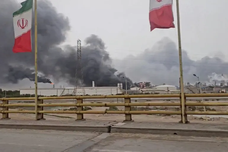 Smoke rises after strikes on the Mahshahr Petrochemical Zone in Bandar Mahshahr County, Khuzestan Province, Iran, in this handout picture released April 4, 2026, and obtained from a social media video. SOCIAL MEDIA/via REUTERS THIS IMAGE HAS BEEN SUPPLIED BY A THIRD PARTY. MANDATORY CREDIT. NO RESALES. NO ARCHIVES. VERIFICATION LINE: Reuters confirmed the location from the flare and smoke stacks, towers, plant buildings, road layout and trees, which matched satellite imagery of the Mahshahr Petrochemical Zone. Coordinates of the area: 30.452590, 49.084840. The date when the video was filmed could not be independently verified, but no older version was found posted online before April 4. Iranian state media reported air strikes at a petrochemical zone in southwestern Iran on Saturday. The Israeli military said that the Israeli Air Force struck infrastructure at a petrochemical complex in Mahshahr, in southwestern Iran, on the same day.