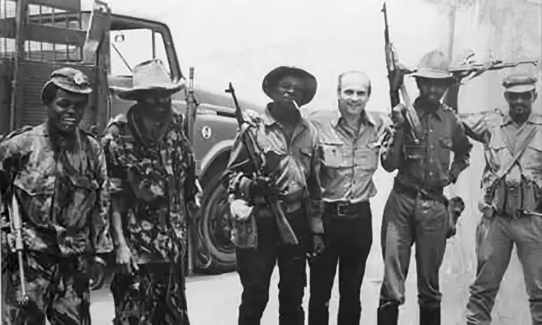 'Making the truth even truer' ... Ryszard Kapuściński with soldiers in Angola, 1975. Photograph: ٥٢PAP/CAF/EPA