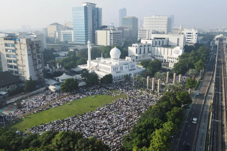 A drone view shows Muslims offering mass prayers during Eid al-Adha at the Great Mosque of Al Azhar in Jakarta, Indonesia, May 27, 2026. REUTERS/Ajeng Dinar Ulfiana