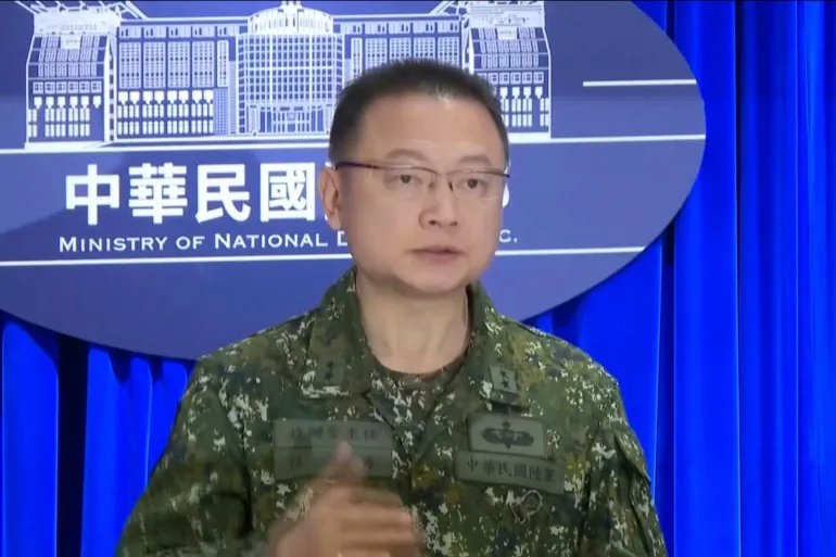 In this image taken off video, Sun Li-fang, Taiwan Defense Ministry spokesperson speaks about China's latest military drills during a press conference in Taipei, Taiwan on Monday, Dec. 29, 2025. (AP Photo/Wu Taijing)