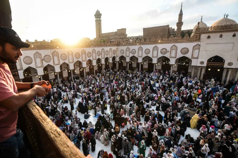 EDITORS NOTE: Graphic content / Muslims gather to take part in a special morning prayer at the Al-Azhar Mosque in Cairo on May 27, 2026, to start Eid al-Adha, the Feast of Sacrifice, marking the end of the annual Hajj pilgrimage to Mecca and commemorating the Prophet Abraham’s willingness to sacrifice his son in obedience to God. (Photo by Ahmed HASAN / AFP)