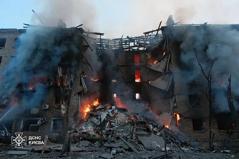 This handout photograph taken and released May 24, 2026 on the official Telegram channel of the Ukraine Ermergency Service shows a heavily damaged building following a Russian strike on the Ukrainian capital Kyiv, amid the Russian invasion in Ukraine.