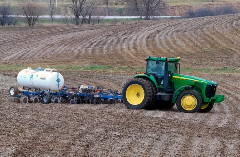A farmer applies anhydrous ammonia fertilizer to a field near Gretna, Neb., Monday, April 6, 2015. (AP Photo/Nati Harnik)