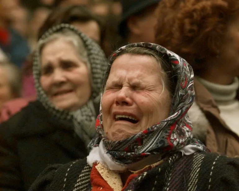 Bosnian Muslim women weep during a downtown Sarajevo rally calling for unity with their former neighbors in the Serb held neighborhood of Grbavica, Monday, Dec. 11, 1995. The rally was for former residents who left the Serb neighborhood during the war. Grbavica is scheduled to return to government control after the signing of the Bosnian peace agreement. (AP Photo/John Gaps III)