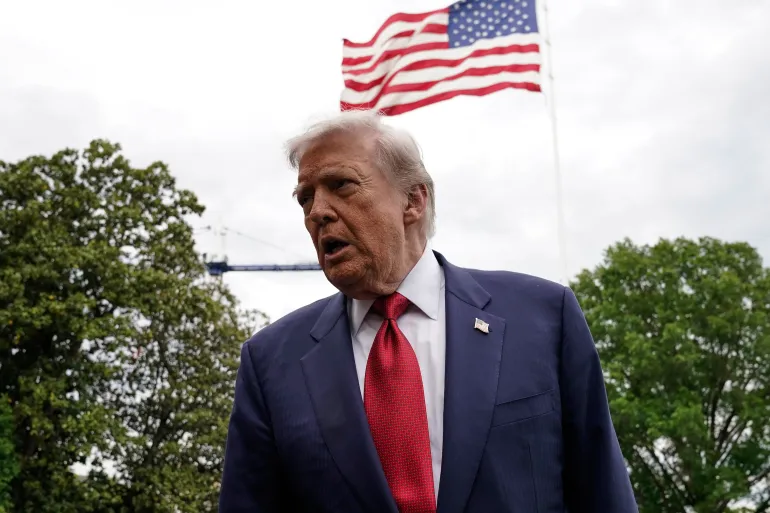 President Donald Trump speaks to reporters as he walks to board Marine One on the South Lawn of the White House, Friday, May 8, 2026, in Washington. (AP Photo/Jose Luis Magana)