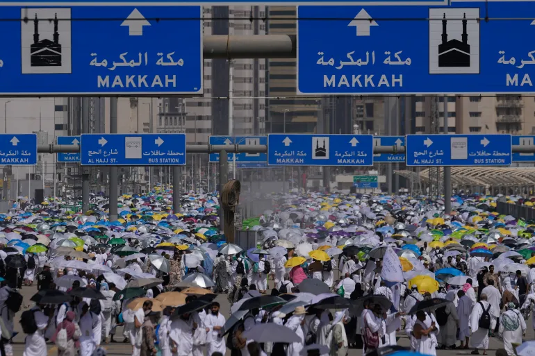Muslim pilgrims leave after casting pebbles at pillars in the symbolic stoning of the devil, the last rite of the annual Hajj, in Mina near the holy city of Mecca, Saudi Arabia, Wednesday, May 27, 2026. (AP Photo/Altaf Qadri)