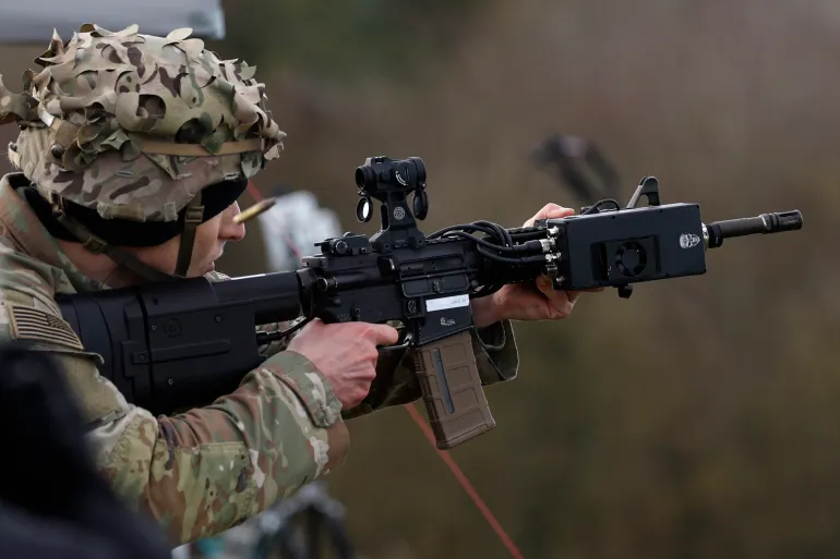 OLDENBURG IN HOLSTEIN, GERMANY - NOVEMBER 21: A participant uses a drone defense rifle of exhibitor AG3 Labs Inc. during a live presentation as part of the Project Flytrap 4.5 exercise of counter-drone technologies at the Putlos military training center on November 21, 2025 at Putlos, Germany. NATO's Allied Land Command and U.S. Army Europe and Africa are working to identify, test, and evaluate both combat-proven capabilities and emerging technology counter-drone systems for land forces. (Photo by Morris MacMatzen/Getty Images)