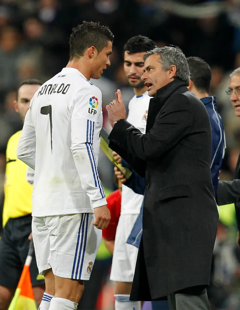 MADRID, SPAIN - DECEMBER 19: Head coach Jose Mourinho (R) of Real Madrid gives instructions to Cristiano Ronaldo during the La Liga match between Real Madrid and Sevilla at Estadio Santiago Bernabeu on December 19, 2010 in Madrid, Spain. Real Madrid won the match 1-0. (Photo by Angel Martinez/Getty Images)