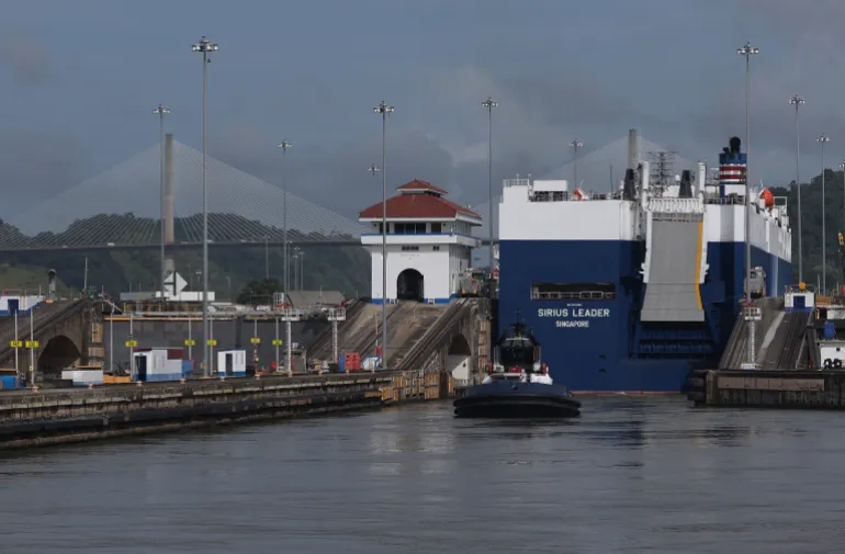 PEDRO MIGUEL, PANAMA - SEPTEMBER 23: Vehicle carrier Sirius Leader enters the Pedro Miguel locks while transiting the Panama Canal on September 23, 2023 in Pedro Miguel, Panama. The Panama Canal Authority is continuing to restrict the number of vessels that pass through the Panama Canal locks as drought has caused water levels at Gatun Lake to drop. The locks depend on millions of gallons of fresh water from the manmade lake to fill locks in Panama City and Colon in order to transit shipping vessels from the Pacific Ocean to the Caribbean Sea. Over 100 ships are waiting to transit the canal and the backup could delay goods heading to the United States for the holiday season. It takes an average of 8-10 hours for a ship to transit the 50 miles through the canal versus several weeks to travel thousands of miles around Cape Horn and the southernmost parts of South America. (Photo by Justin Sullivan/Getty Images)