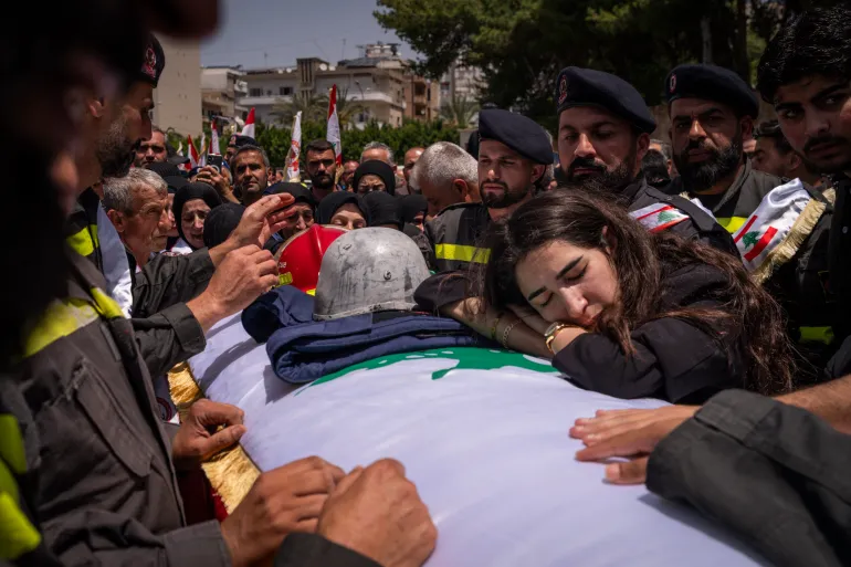 SIDON, LEBANON - MAY 13: Colleagues and relatives of the Civil Defense killed in a IDF airstrike during the funeral ceremony on May 13, 2026 in Sidon, Lebanon. Despite last month's ceasefire agreement between Israel and Lebanon, Israel has conducted regular strikes in the southern part of the country citing the continued threat of Hezbollah, the Iran-backed militant group. (Photo by Adri Salido/Getty Images)