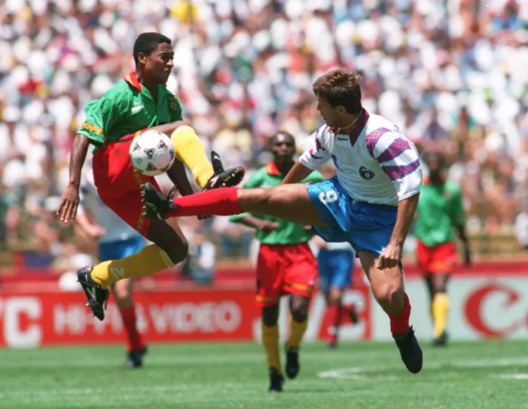 28 JUN 1994: OLEG SALENKO OF RUSSIA, RIGHT, AND VICTOR NDIP AKEM OF CAMEROON IN ACTION DURING THE 1994 WORLD CUP MATCH RUSSIA V CAMEROON AT STANFORD STADIUM IN PALO ALTO, CALIFORNIA Mandatory Credit: Steve Dunn/ALLSPORT