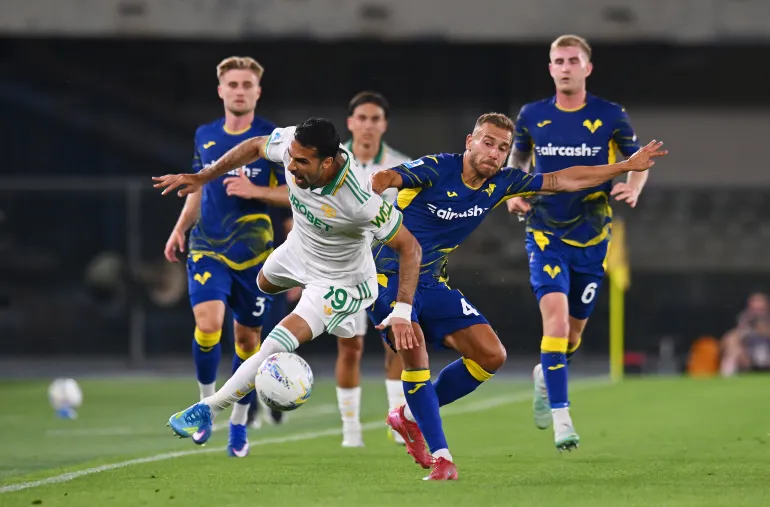 VERONA, ITALY - MAY 24: Zeki Celik of AS Roma is challenged by Sandi Lovric of Hellas Verona during the Serie A match between Hellas Verona FC and AS Roma at Stadio Marcantonio Bentegodi on May 24, 2026 in Verona, Italy. (Photo by Alessandro Sabattini/Getty Images)