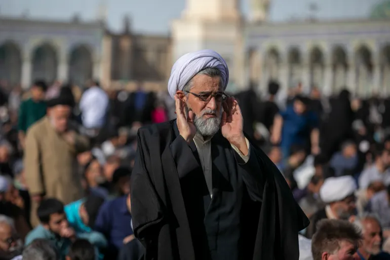 QOM, IRAN - MAY 26: A man attends a religious ceremony during Eid al-Adha on May 26, 2026 in Qom, Iran. Eid al-Adha (the Festival of Sacrifice) is one of the most sacred holidays in Islam, expected to be celebrated from 26–27 May 2026 until 29–30 May 2026 depending on regional moon sightings. It honors the willing of Prophet Ibrahim to sacrifice his son, Ismail, in obedience to God's command and marks the conclusion of the annual Hajj pilgrimage to Mecca. (Photo by Majid Saeedi/Getty Images)