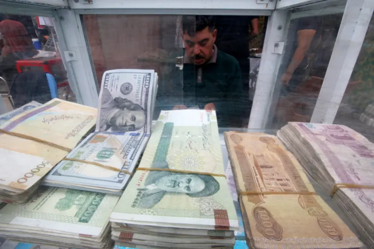 A man counts Iranian rials at a currency exchange shop, before the start of the U.S. sanctions on Tehran, in Basra, Iraq November 3, 2018. Picture taken November 3, 2018. REUTERS/Essam al-Sudani