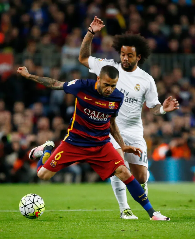 Football Soccer - FC Barcelona v Real Madrid - La Liga - Camp Nou, Barcelona - 2/4/16 Barcelona's Dani Alves and Real Madrid's Marcelo Reuters / Juan Medina Livepic EDITORIAL USE ONLY.