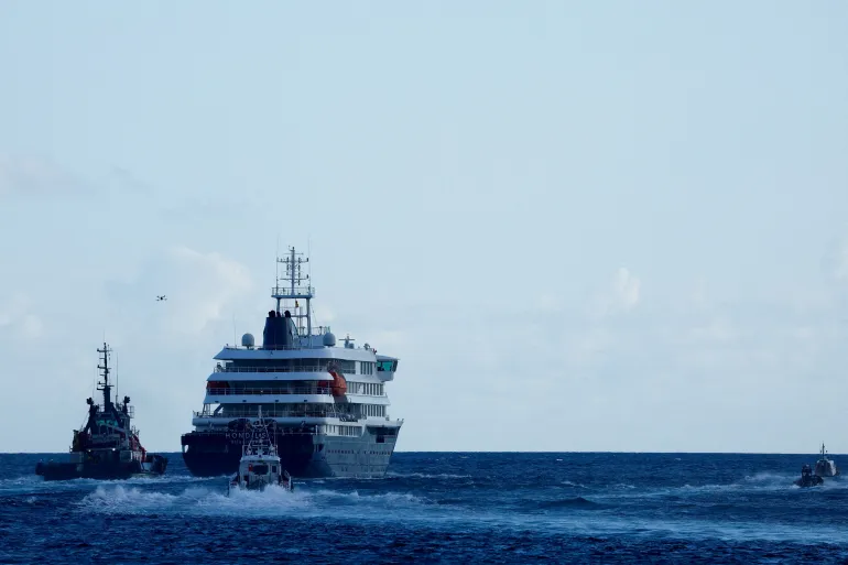 FILE PHOTO: The cruise ship MV Hondius, affected by a hantavirus outbreak, leaves the port of Granadilla de Abona, Tenerife, Spain May 11, TPX IMAGES OF THE DAY/File Photo