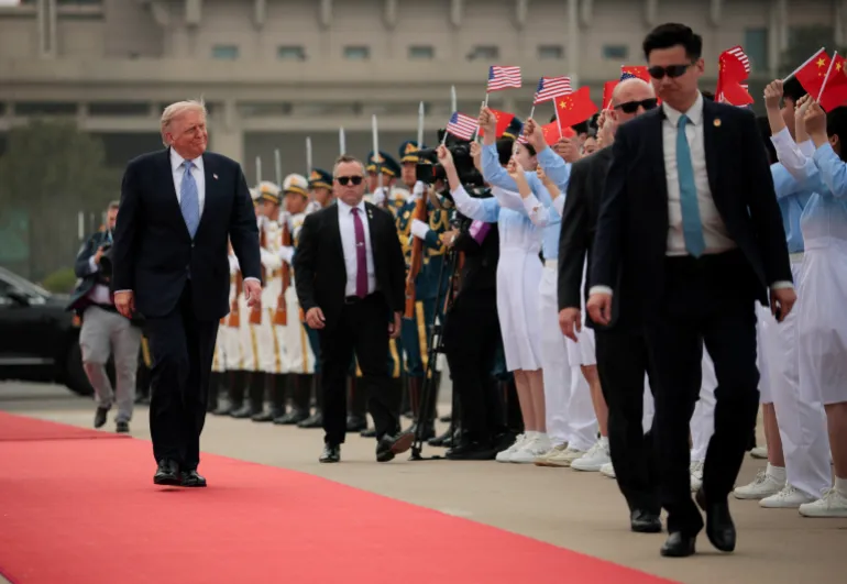 U.S. President Donald Trump reacts as he walks towards Air Force One at Beijing Capital International Airport, in Beijing, China, May 15, 2026. REUTERS/Evan Vucci