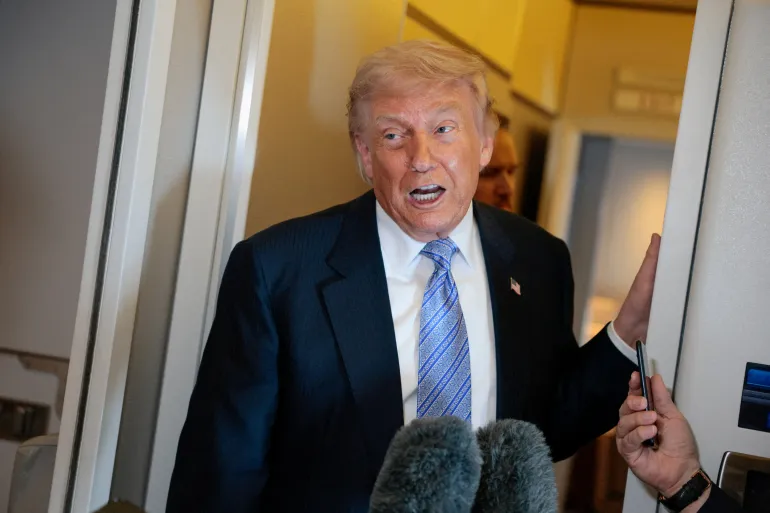 FILE PHOTO: U.S. President Donald Trump speaks to the press aboard Air Force One enroute to the U.S. following his official visit with President Xi Jinping in China, May 15, 2026. REUTERS/Evan Vucci/File Photo