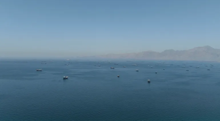 A drone view shows vessels anchored at the Strait of Hormuz, as seen from Musandam, Oman, May 25, 2026. REUTERS/Stringer REFILE - CORRECTING INFORMATION FROM "VESSELS SAILING THROUGH THE STRAIT OF HORMUZ" TO "VESSELS ANCHORED AT THE STRAIT OF HORMUZ".