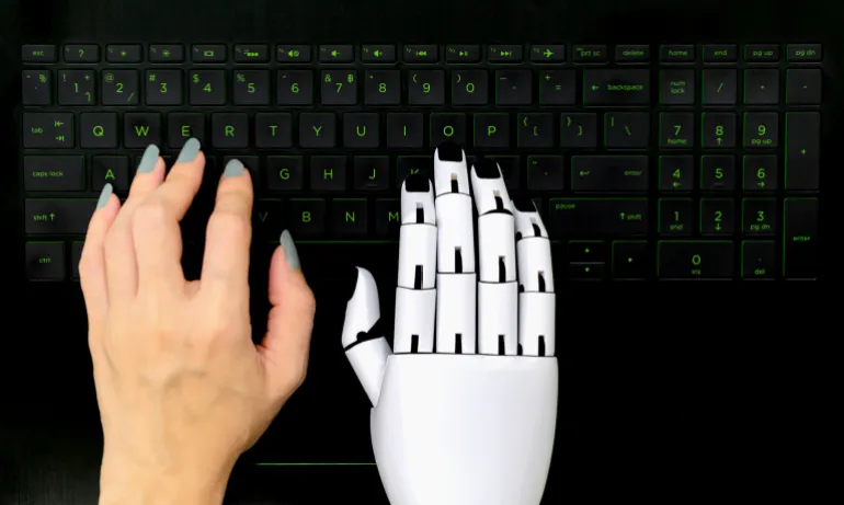 Robot concept chatbot of Human hand and robot hand pressing computer keyboard enter