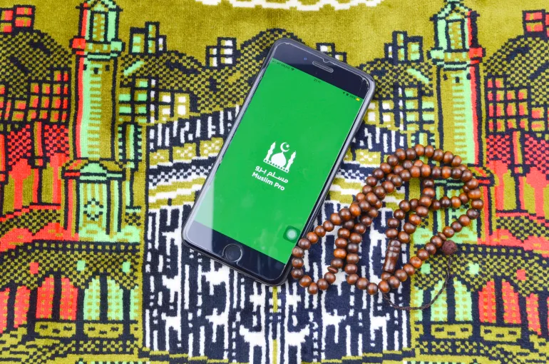 Puchong, Malaysia - July 05, 2019; Flatlay concept for Muslim Pro icon apps for muslim. Very popular apps for reading quran, performing pray or "solah" and qibla direction. Best islamic apps in 2019.