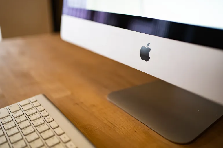 Bangkok, Thailand - February 12, 2022: Apple Inc. logo on iMac computer.