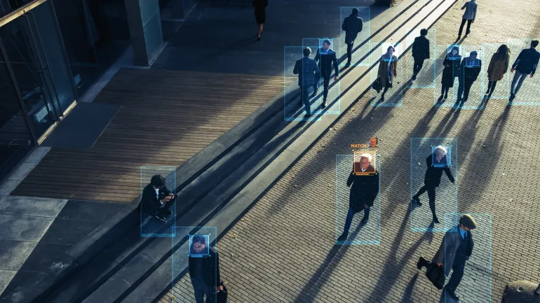 CCTV AI Facial Recognition Camera Zoom in Recognizes Person. Elevated Security Camera Surveillance Footage Face Scanning of a Crowd of People Walking on Busy Urban City Streets. Big Data Analysis