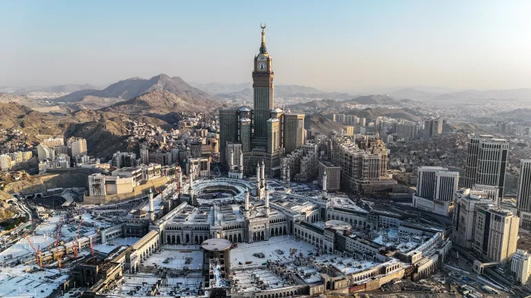 Mecca , Saudi Arabia Mars 30 2024: Makkah city Streets hotels and transportation Makkah Clock Tower - Masjid Al Haram drone aerial view