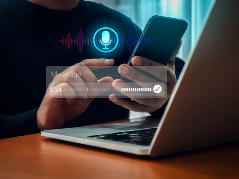 AI chatbot conversation and voice searching automation, voice recognition technology concept. Personal conversational assistant technology with digital sound wave audio graphic on smartphone in hand.