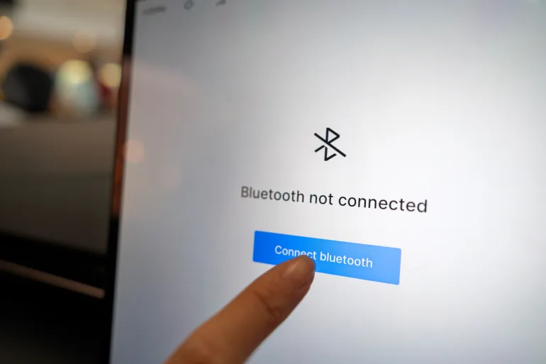 Penang, Malaysia – May 3, 2025: Close-up view of a digital touchscreen interface in a Proton e.Mas EV, displaying a prompt to connect Bluetooth, highlighting modern in-car technology and connectivity.