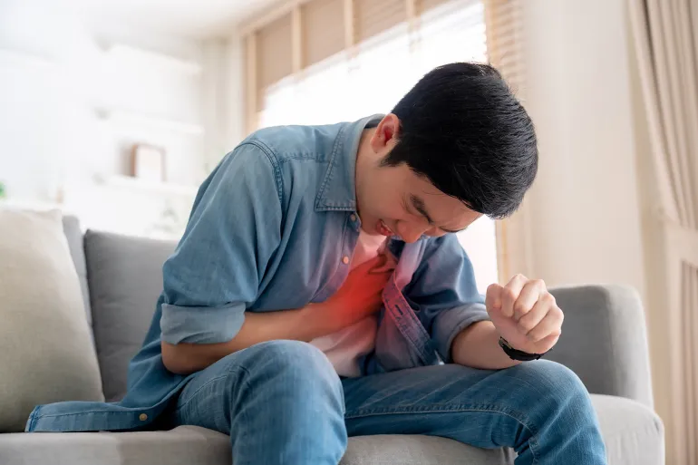 Young asian man with chest pain suffering from heart attack, health and medical, world heart day, cardiovascular disease. Healthcare and insurance concept; Shutterstock ID 2686944973; purchase_order: aj; job: ; client: ; other: