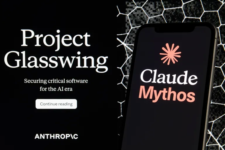 A smartphone displays the Claude Mythos application logo against a dark background with text about Anthropic's Project Glasswing initiative in San Ferdinando di Puglia, Italy, on May 17, 2026. The company's wordmark appears at the lower left of the background screen alongside a ''Continue reading'' call-to-action. The smartphone shows Claude Mythos branding with the Anthropic coral asterisk symbol. The image juxtaposes Anthropic's cybersecurity research program with its AI product lineup. (Photo Illustration by Matteo Della Torre/NurPhoto via Getty Images)