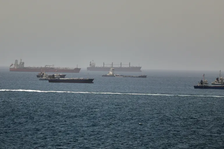 Tankers and cargo vessels are seen in the Gulf of Oman, along shipping routes linking the Strait of Hormuz and the Arabian Sea, Tuesday, June 16, 2026. (AP Photo)