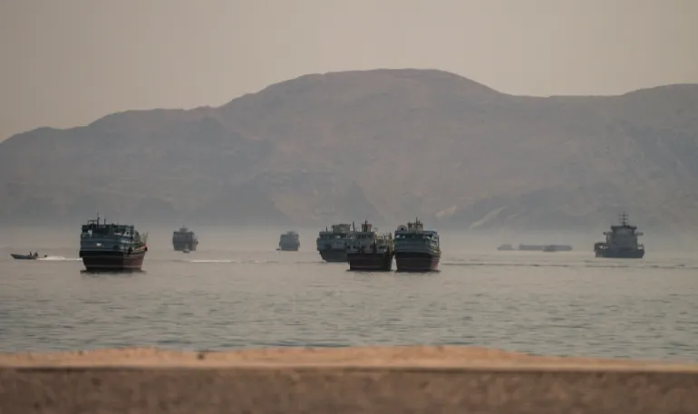 Vessels are anchored in the Strait of Hormuz, as seen from Musandam, Oman, June 19, 2026. REUTERS/Stringer