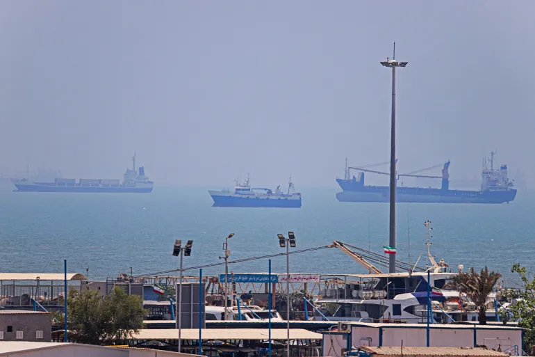 In this picture obtained from Iran's ISNA news agency on June 18, 2026, vessels are seen anchored in Bandar Abbas along the Strait of Hormuz.