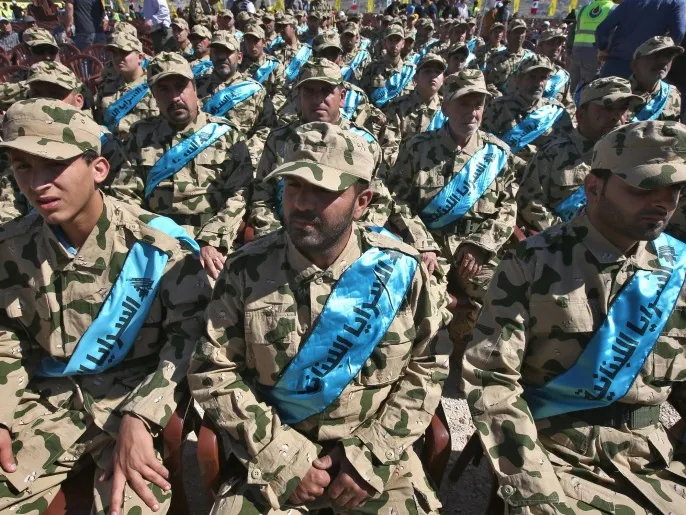 Members of the Lebanese Resistance Brigades, a Hezbollah armed and funded militant group, attend a rally commemorating "Liberation Day," which marks the withdrawal of the Israeli army from southern Lebanon in 2000, in the southern border town of Bint Jbeil, Lebanon, Sunday, May 25, 2014. Hezbollah’s leader Sheik Hassan Nasrallah is warning that hardline foreign fighters in Syria pose a global threat as they return home. Nasrallah accused European countries of easing the flow of extremist fighters into Syria, where they have fought against the rule of President Bashar Assad. (AP Photo/Hussein Malla)