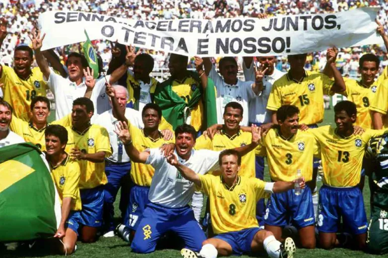 The victorious Brazilian team celebrate winning the final with a banner in memory of the Brazilian Formula One star, Ayrton Senna who was killed in San Marino in May. (Photo by Peter Robinson/EMPICS via Getty Images)