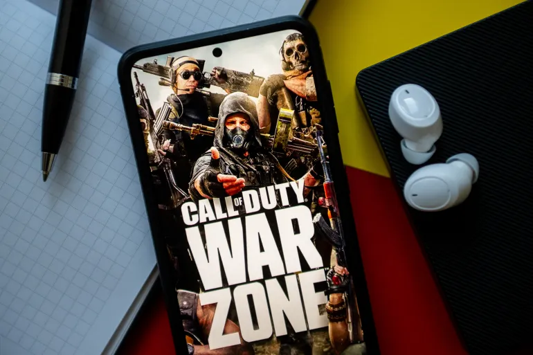 POLAND - 2023/11/02: In this photo illustration a Call of Duty War Zone logo seen displayed on a smartphone. (Photo Illustration by Mateusz Slodkowski/SOPA Images/LightRocket via Getty Images)