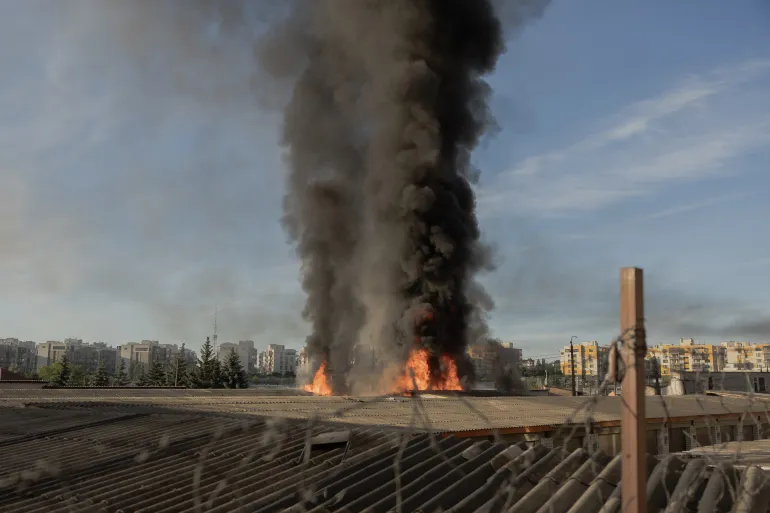 TOPSHOT - Smoke and flames rise from garages damaged during a Russian missile and drone strikes, in Kyiv on June 2, 2026, amid Russian invasion in Ukraine.
