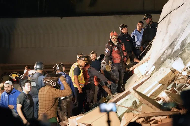 Rescuers work on the remains of a collapsed building following an earthquake in Caracas on June 24, 2026.