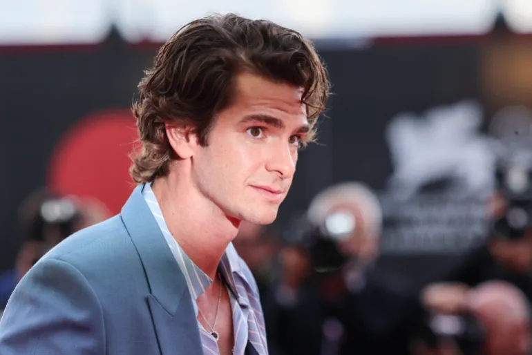 Cast member Andrew Garfield poses on the red carpet for the screening of the movie "After the Hunt" out of competition, at the 82nd Venice International Film Festival, Venice, Italy, August 29, 2025. REUTERS/Yara Nardi